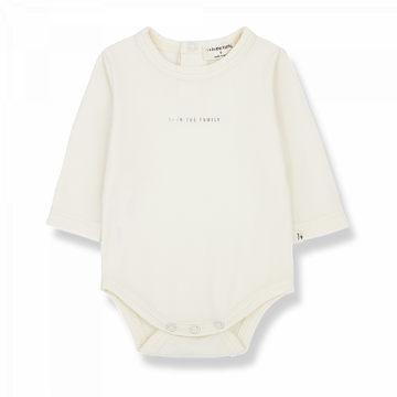 Body neonato a manica lunga in tonalità ecru.