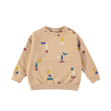 Una bellissima felpa bambina in caldo cotone biologico sui toni del rosa cipria con tante forme stilizzate su tutto il capo. Apertura altezza spalla con bottoncini a pressione, scollo rotondo a costine, elastico in vita e sulle maniche.