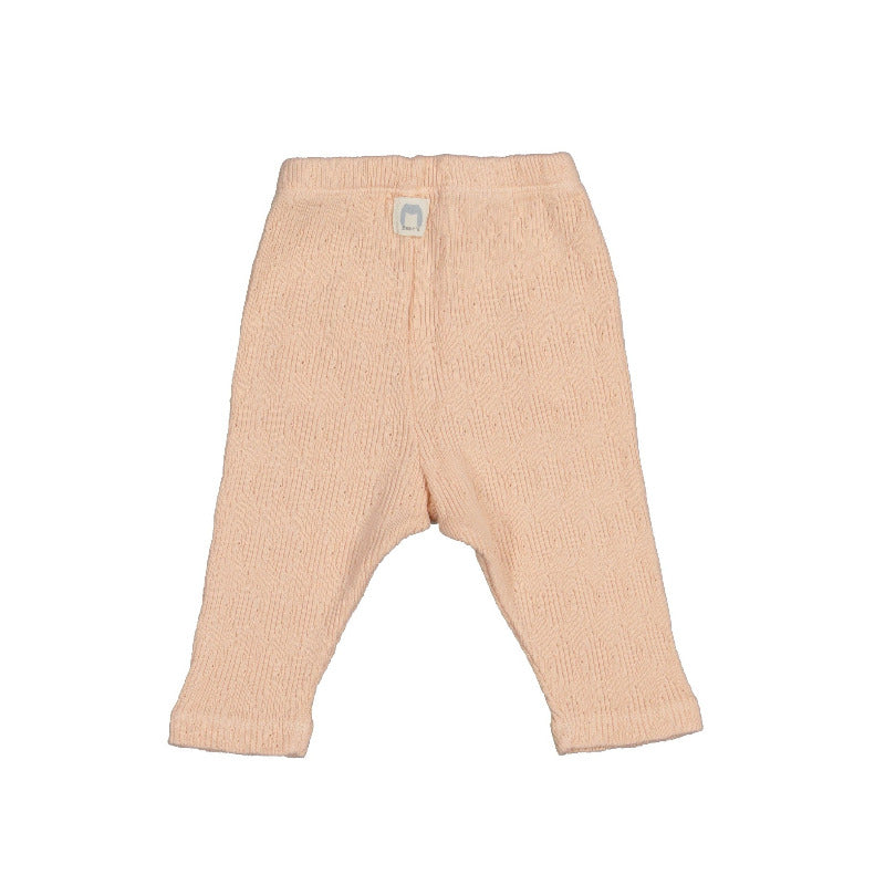 pantalone neonata in cotone biologico, lavorato a maglia, in tonalità rosa. Finta abbottonatura, elastico in vita,due tasche applicate frontali