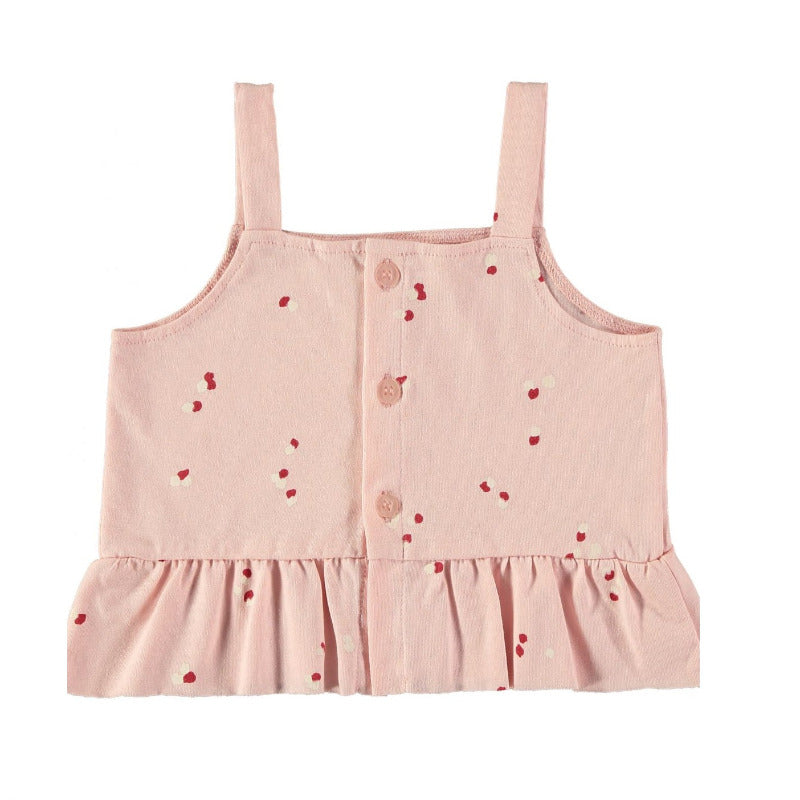 Un grazioso top per la vostra bambina in cotone biologico, con tanti piccoli petali su tonalità rosa. Apertura posteriore tramite bottoni, volants sula parte inferiore del top.